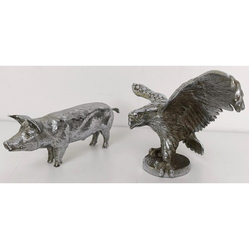 430 - A chrome plated car mascot, in the form of an eagle, wingspan 24.5 cm, and a chrome plated boar, 17.... 