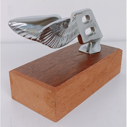 456 - A Bentley backwards leaning Winged B mascot, 5.5 cm high, mounted on a wooden block