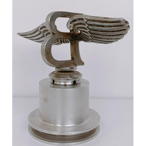 457 - A Bentley Winged B mascot, repaired, 23 cm wingspan, on a modern stand