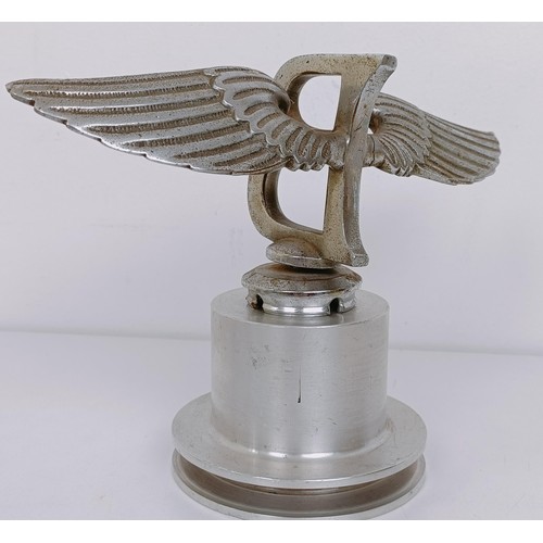 457 - A Bentley Winged B mascot, repaired, 23 cm wingspan, on a modern stand