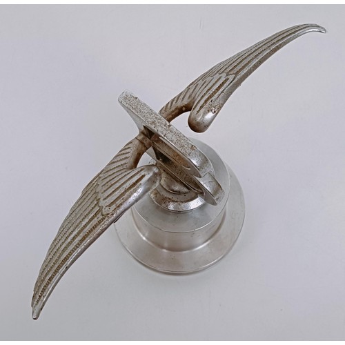 457 - A Bentley Winged B mascot, repaired, 23 cm wingspan, on a modern stand