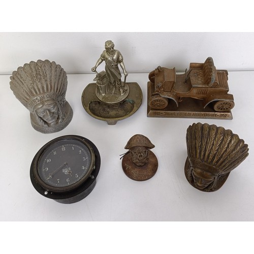 463 - A dashboard clock, two Mack emblems, a Volcan and other items Provenance: From the estate of the lat... 