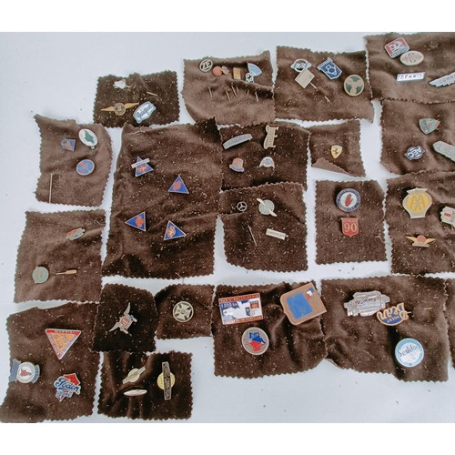 477 - A good collection of small badges, tie pins, and other similar items, including NSU, Rover, Dodge, A... 