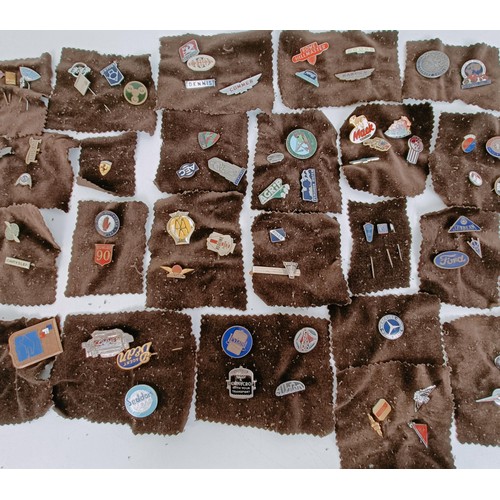 477 - A good collection of small badges, tie pins, and other similar items, including NSU, Rover, Dodge, A... 