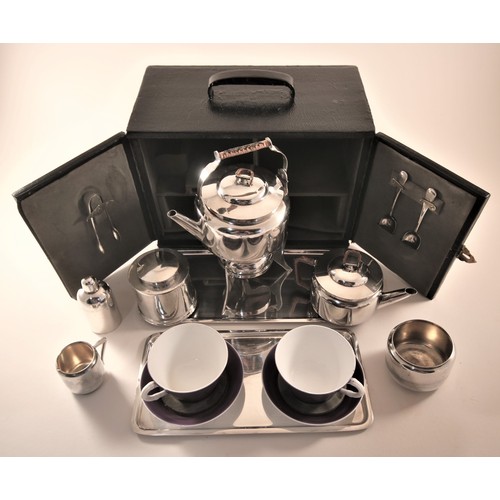 421 - A fine Edwardian 1909 travelling picnic tea set, designed by the legendary Dr. Christopher Dresser, ... 