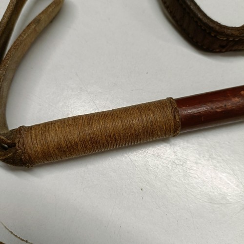 704 - A riding crop, with a silver mount, and another (2)