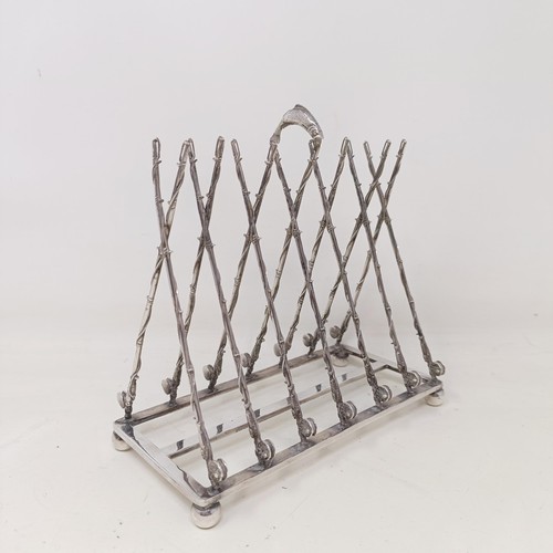 708 - A late Victorian silver plated novelty toast rack, the divisions in the form of fishing rods and ree... 