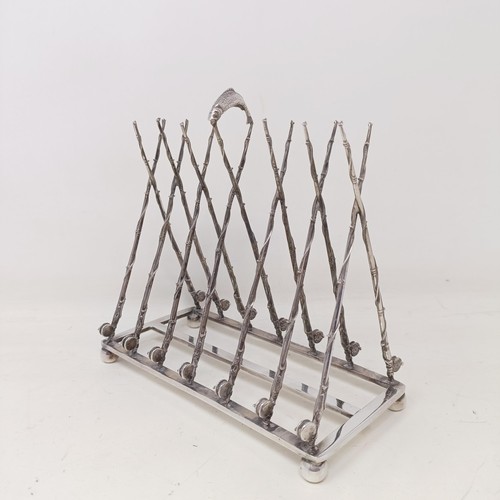 708 - A late Victorian silver plated novelty toast rack, the divisions in the form of fishing rods and ree... 