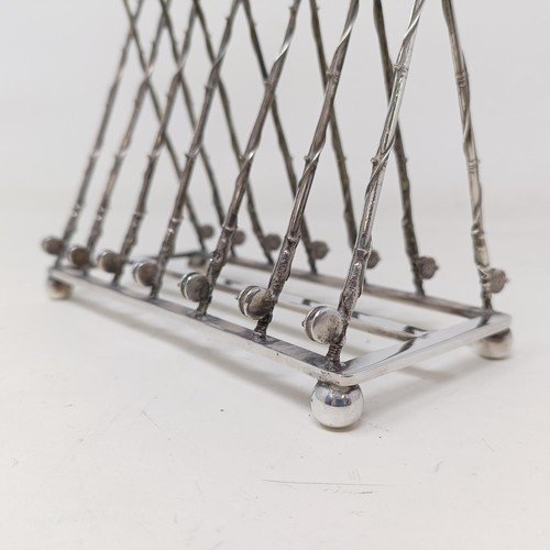 708 - A late Victorian silver plated novelty toast rack, the divisions in the form of fishing rods and ree... 