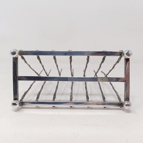 708 - A late Victorian silver plated novelty toast rack, the divisions in the form of fishing rods and ree... 