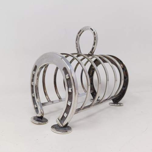 709 - A late Victorian silver plated novelty toast rack, the ends in the form of horseshoes, 14 cm wide