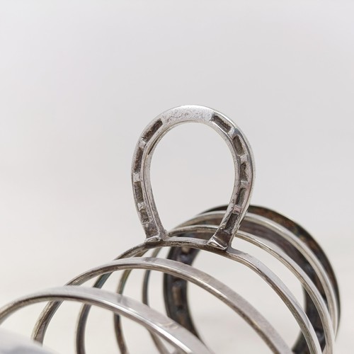 709 - A late Victorian silver plated novelty toast rack, the ends in the form of horseshoes, 14 cm wide