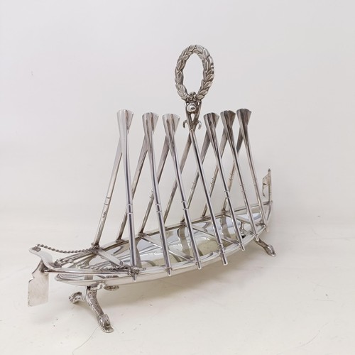 713 - A late Victorian silver plated novelty toast rack, in the form of a rowing boat, the divisions in th... 