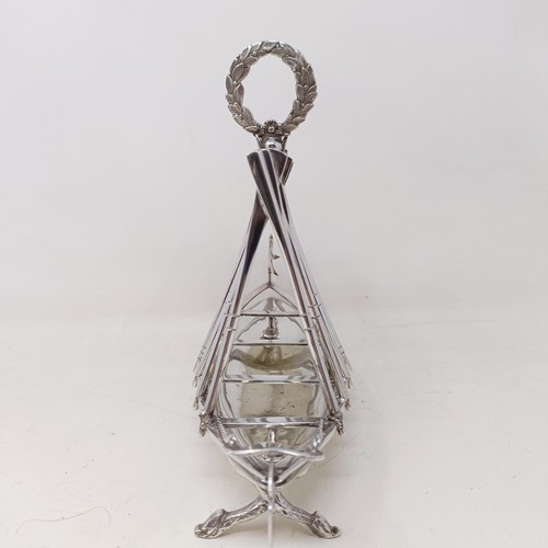 713 - A late Victorian silver plated novelty toast rack, in the form of a rowing boat, the divisions in th... 