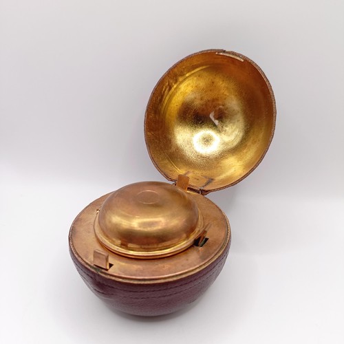 719 - A Victorian novelty inkwell, in the form of a cricket ball, 7 cm diameter