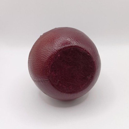 719 - A Victorian novelty inkwell, in the form of a cricket ball, 7 cm diameter