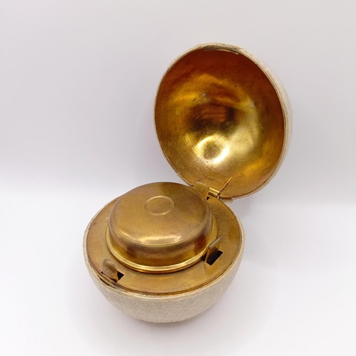 720 - A Victorian novelty travelling inkwell, in the form of a tennis ball, 7 cm diameter