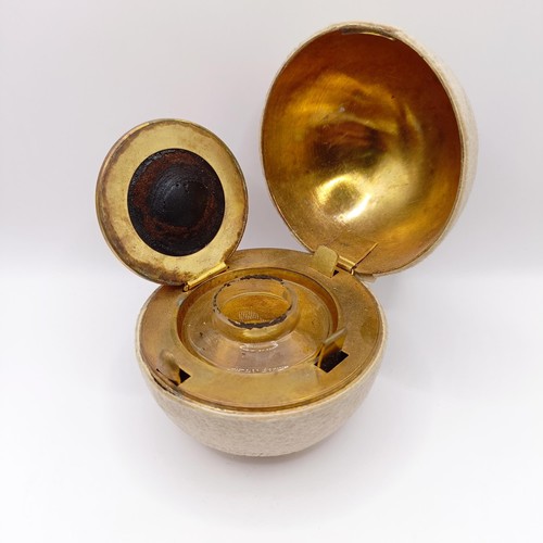 720 - A Victorian novelty travelling inkwell, in the form of a tennis ball, 7 cm diameter