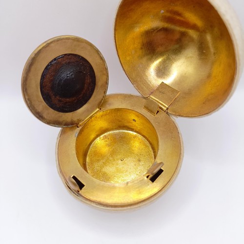 720 - A Victorian novelty travelling inkwell, in the form of a tennis ball, 7 cm diameter