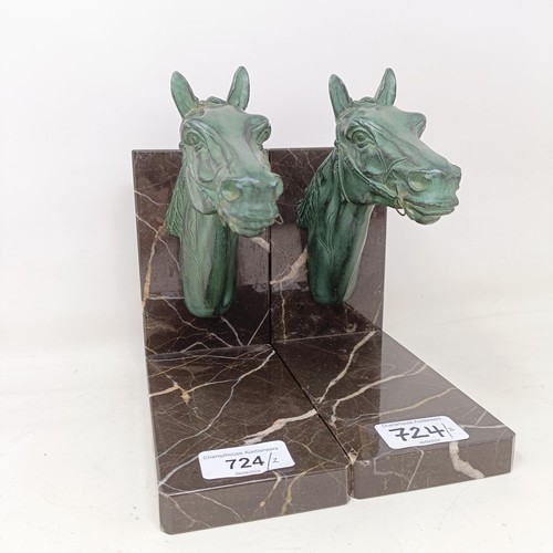 724 - A pair of marble and spelter bookends, in the form horse heads, 17 cm wide (2)