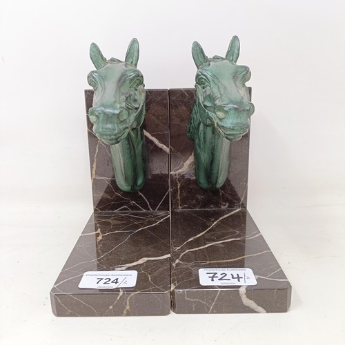 724 - A pair of marble and spelter bookends, in the form horse heads, 17 cm wide (2)