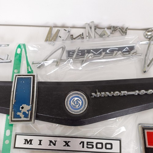 453 - Assorted car badges, including Hillman, Ford, Humber and other various makes