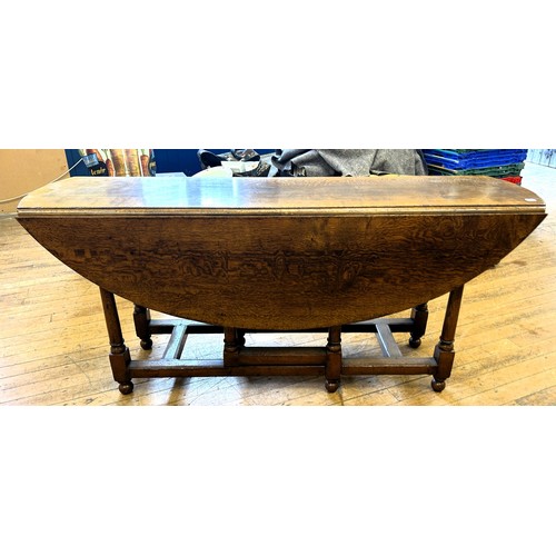 1018 - An 18th century style oak gateleg wake type table, stamped Titchmarsh & Goodwin, 170 cm wide