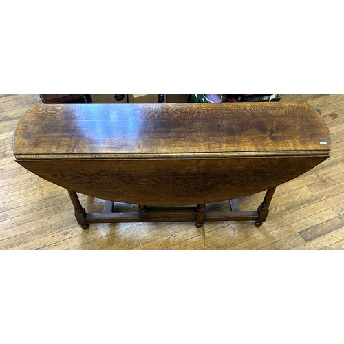 1018 - An 18th century style oak gateleg wake type table, stamped Titchmarsh & Goodwin, 170 cm wide