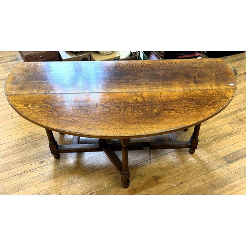 1018 - An 18th century style oak gateleg wake type table, stamped Titchmarsh & Goodwin, 170 cm wide