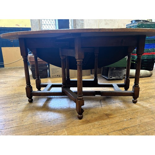 1018 - An 18th century style oak gateleg wake type table, stamped Titchmarsh & Goodwin, 170 cm wide