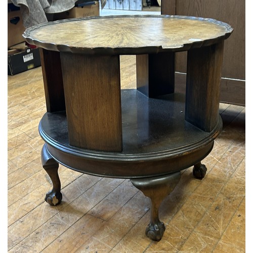 1061 - A 1920s walnut coffee table/bookcase, 51 cm diameter