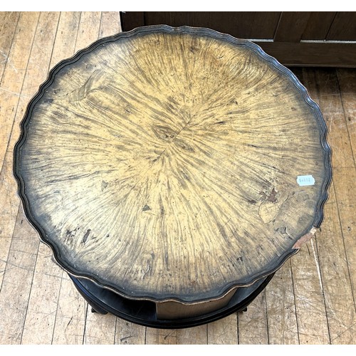 1061 - A 1920s walnut coffee table/bookcase, 51 cm diameter