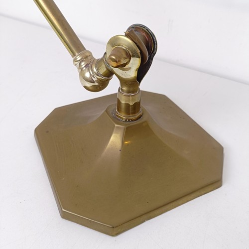 800 - An early 19th century brass adjustable table lamp, on a squared base