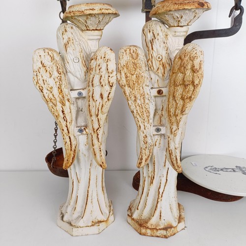 816 - A pair of painted cast iron candlesticks, in the form of angels, 49 cm high, and a set of scales and... 