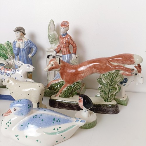 818 - A Rye Pottery figure of a lady, 27 cm high, another of a farmer and sow, 24 cm and other Rye Pottery... 