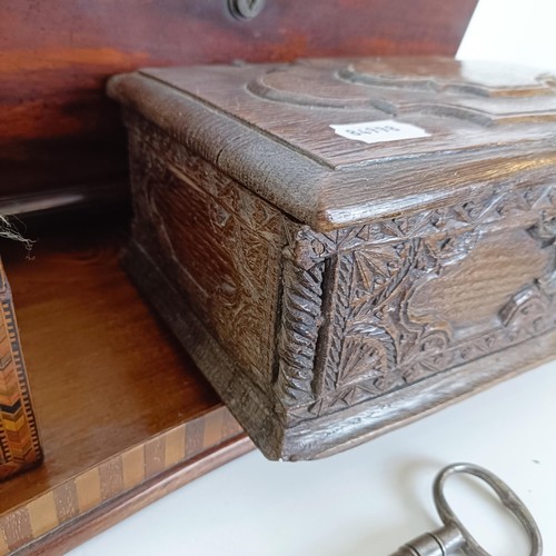 819 - A 19th century rosewood tea caddy, 40 cm wide, a carved oak box, a caddy, a plate stand and a mahoga... 