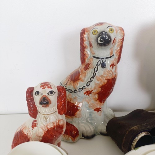 827 - A pair of Staffordshire flatback spaniels, a Poole lamp, a part tea service, a Dresden figure, a mir... 