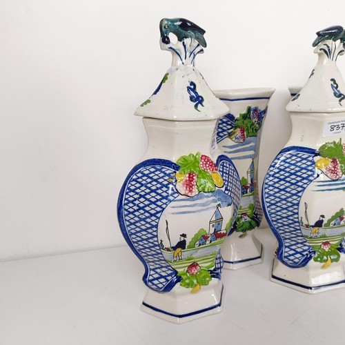 837 - A Delft garniture, comprising three vases with lids, 34 cm high, and a pair of vases, 26 cm high (5)