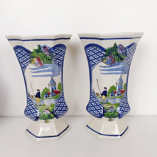 837 - A Delft garniture, comprising three vases with lids, 34 cm high, and a pair of vases, 26 cm high (5)