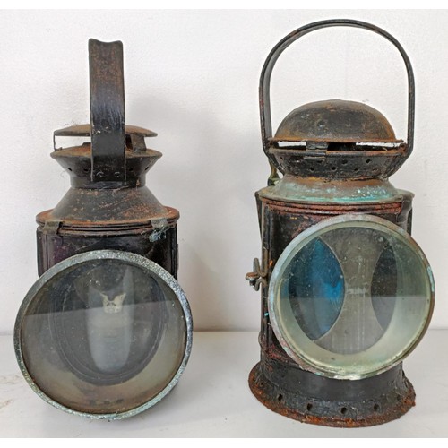 864 - A railway lamp, stamped BR(M), 29 cm high, its pair, and another lamp (3)