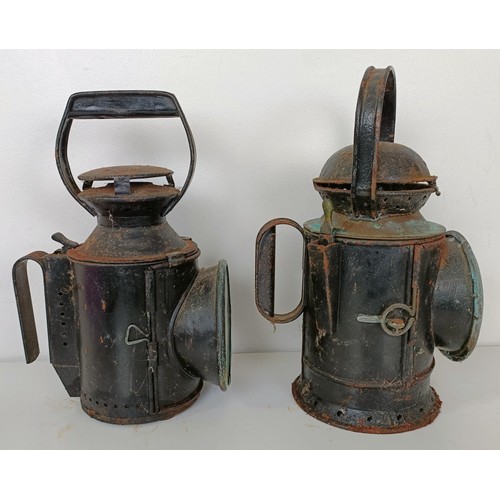 864 - A railway lamp, stamped BR(M), 29 cm high, its pair, and another lamp (3)