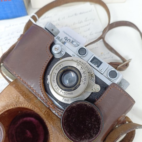 906 - A Leica IIIb camera, circa 1937/38, serial number 242449, in a leather case, with manual and tables ... 