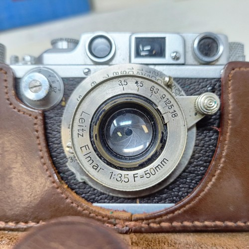 906 - A Leica IIIb camera, circa 1937/38, serial number 242449, in a leather case, with manual and tables ... 