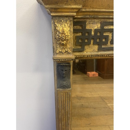 1098 - A gilt framed overmantel mirror, decorated in a classical manner, 93 cm x 130 cm