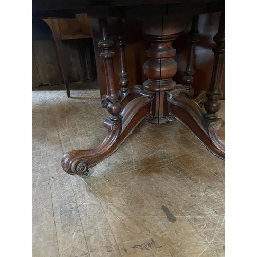 1028 - A 19th century mahogany oval extending dining table, raised on a turned column base, 137 cm wide, wi... 