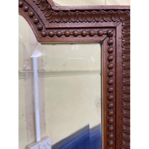 1015 - A late 19th century satinwood framed three fold screen, inset with bevelled glass panels, and floral... 