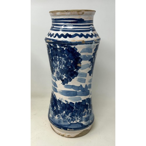 889 - A Delft blue and white albarello, 27 cm high, and another, 32 cm high (2)