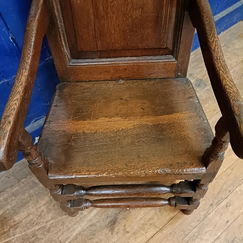 1050 - An oak Wainscot type armchair