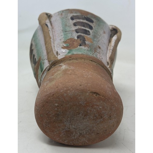 895 - An 18th century Spanish pottery mortar, 18 cm high