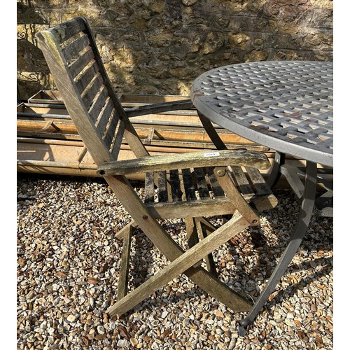 1089 - A large metal garden table, 114 cm diameter, and two wooden garden chairs (3)